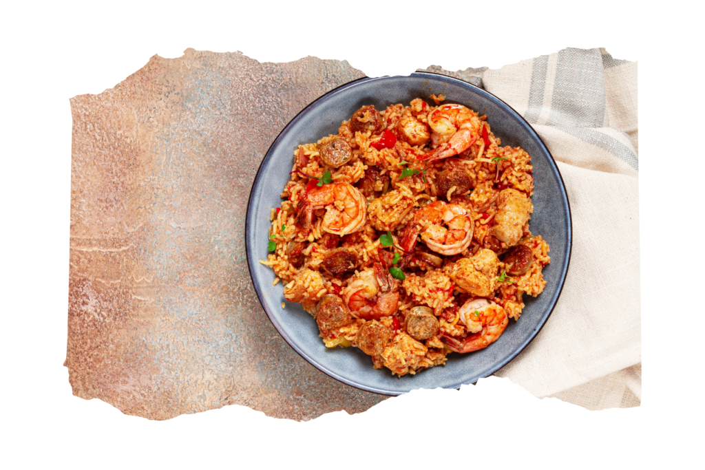 a torn picture of shrimp creole against a stone counter with a teatowel.